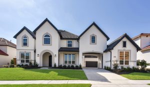 Lexington Country - The Estates in Frisco Texas The split arrangement of the Venetian features a private motor court..  Impressive two story foyer with its elegant curved stairs opens to the an impressive dining room, which is adjacent to the two story great room, complemented by the fireplace.  The generous kitchen is complete with a center island, walk-in pantry, adjoining breakfast area, accompanied with striking curved window display and entrance to the patio.  The master suite with its abundance of windows includes a curved window display, master bath featuring an oversized walk-in closet, dual vanities, separated by a vanity cabinet, shower with seating area, and a soaker tub.  The second floor includes the additional bedrooms, oversized game room and a resource center.